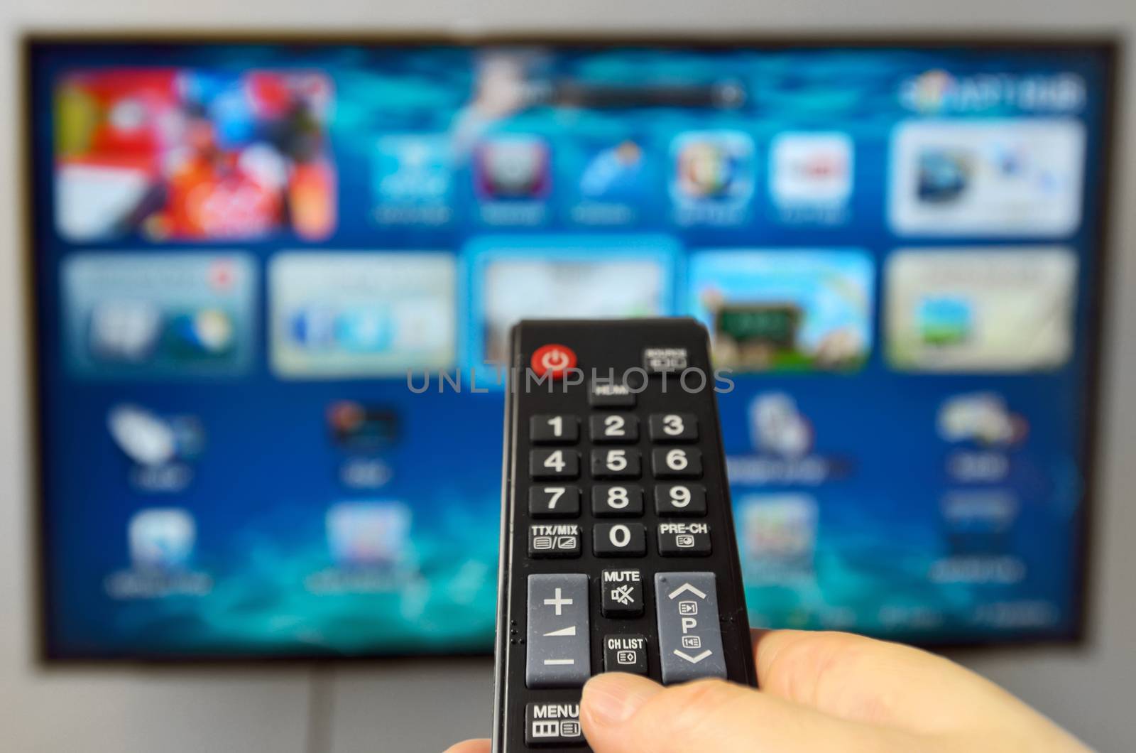 Smart tv and hand hold the remote control