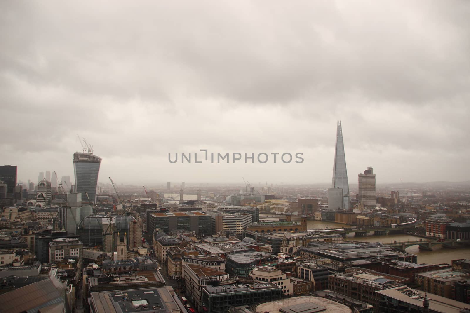 Dark sky and rain over wet London panorama view