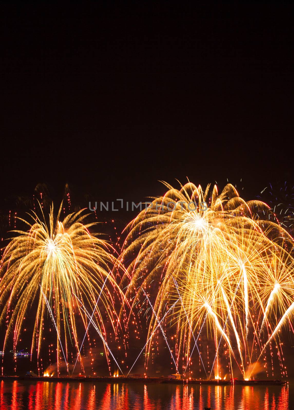 Volleys of beautiful fireworks in the night sky by jee1999