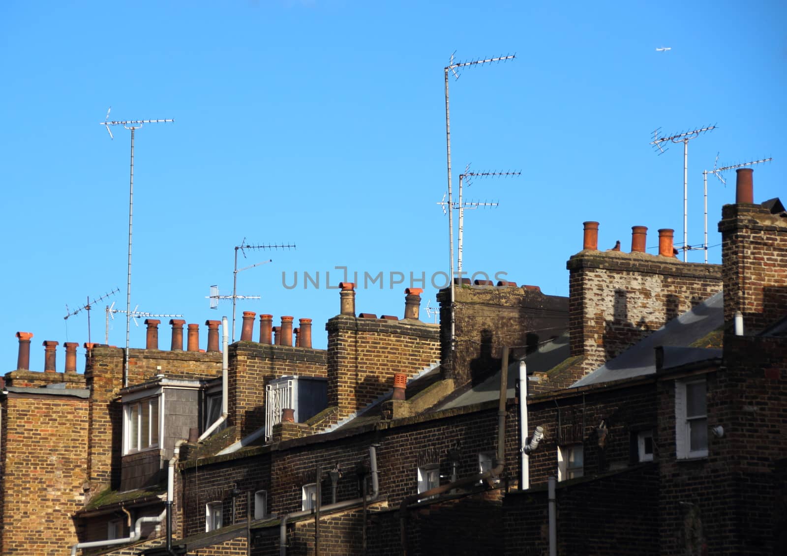 Roof top with chimneys and antennas