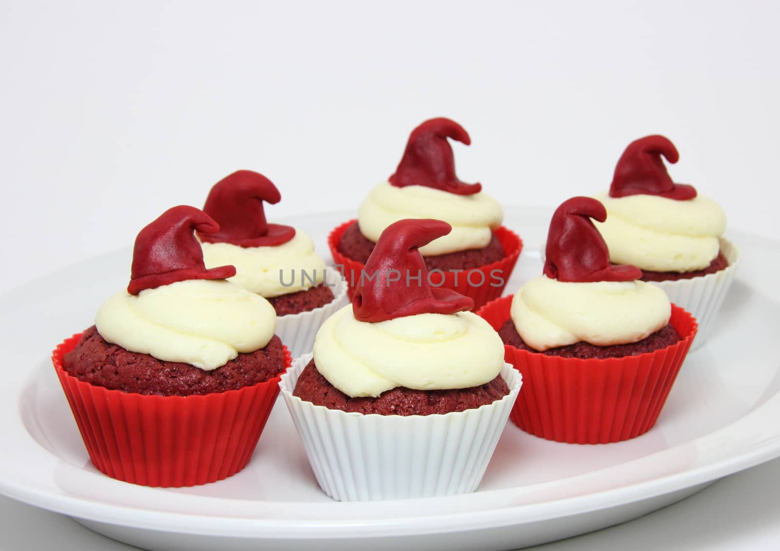 Selection of red velvet cupcakes with cream cheese frosting