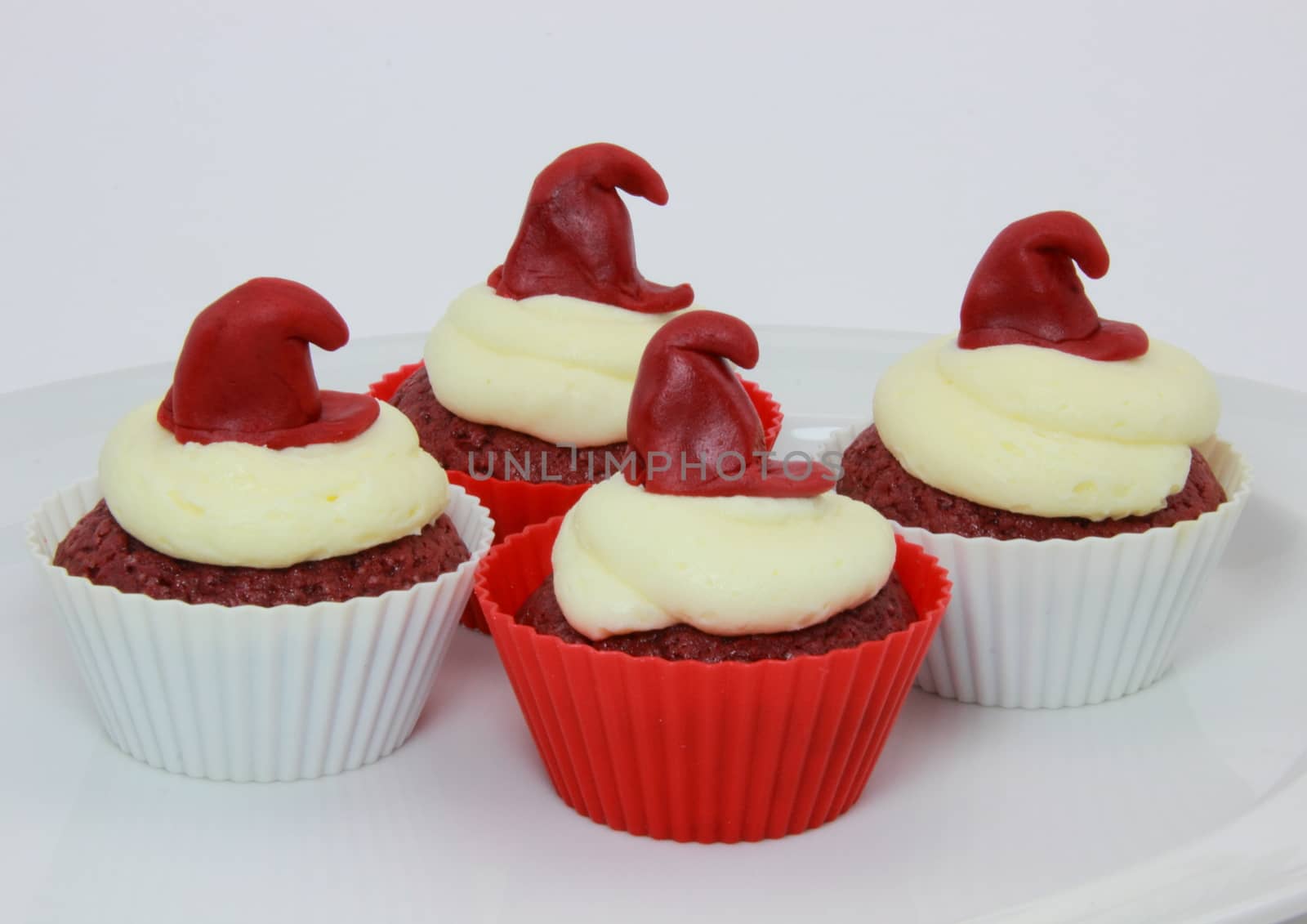 Selection of red velvet cupcakes with cream cheese frosting