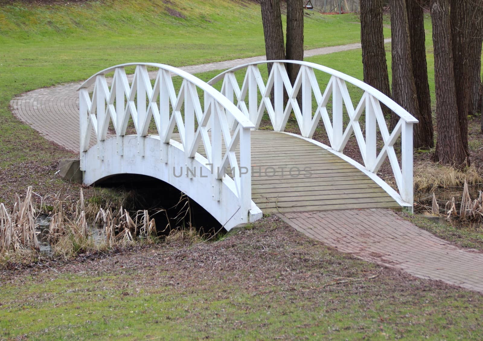 White bridge and path in park