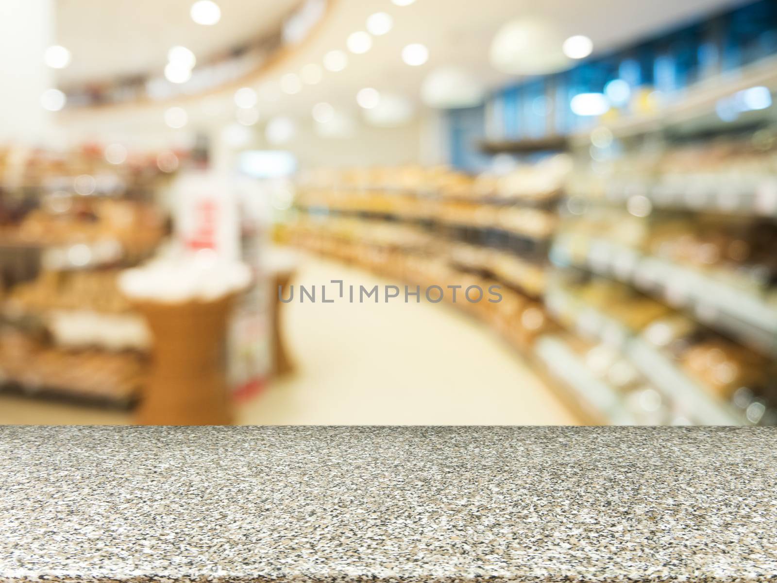 Marble empty table in front of blurred supermarket by fascinadora