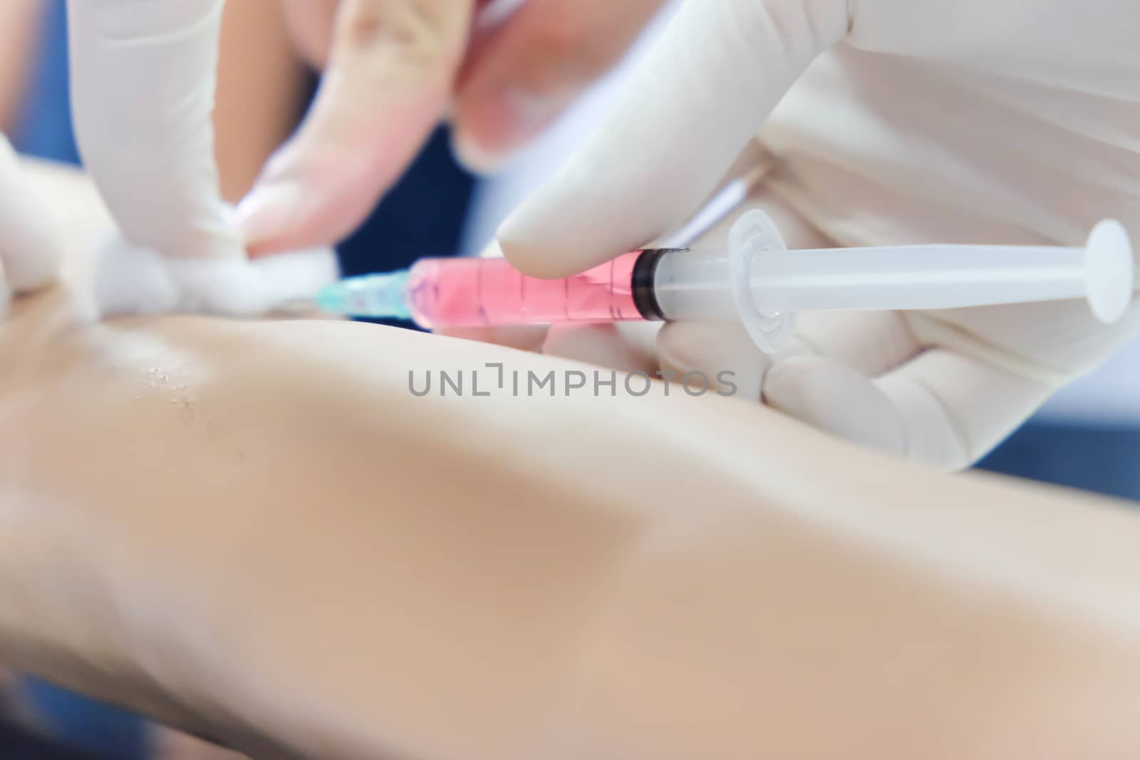 close up of Nurse makes vaccination of patient background,injection needle