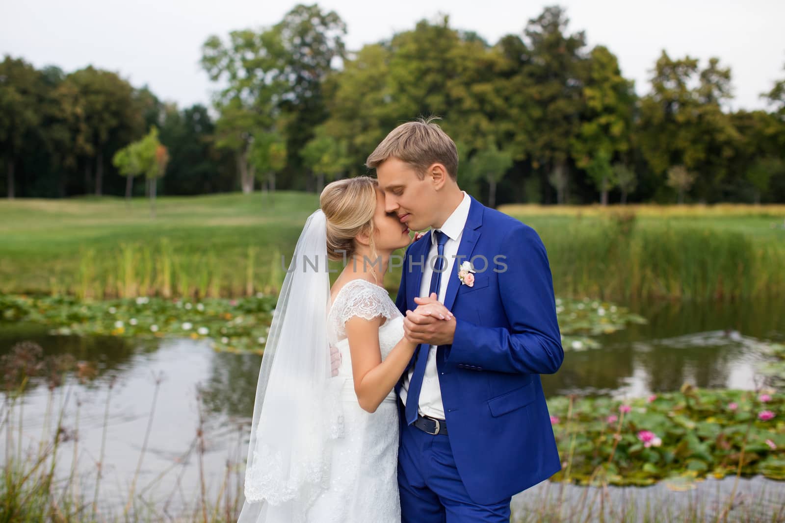 The groom gently hugged the bride