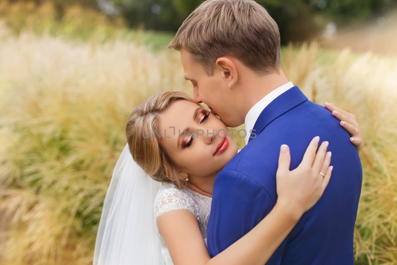 Newlyweds on a walk in the countryside by lanser314