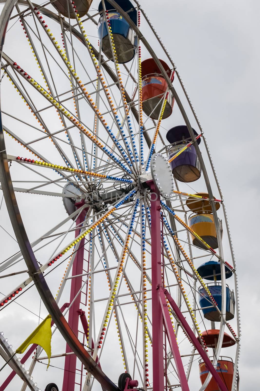 A colorful Ferris Wheel at a country fair