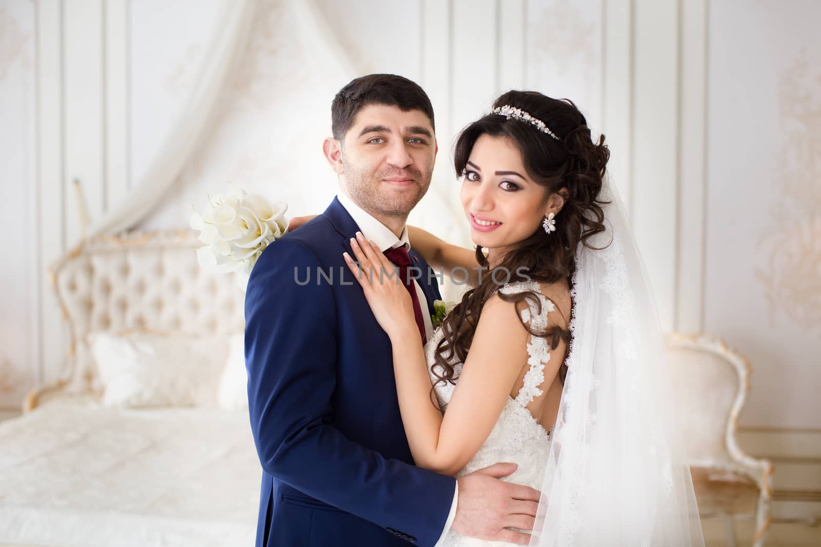 The groom gently hugged the bride on the wedding day