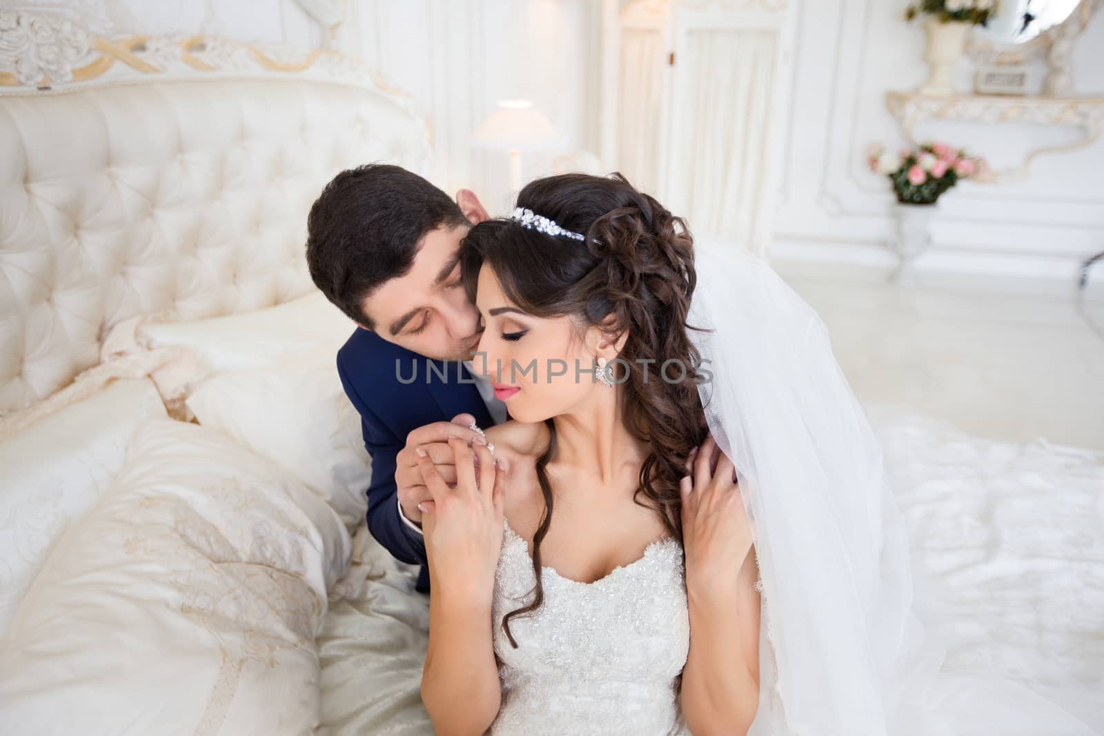 The groom gently hugged the bride on the wedding day