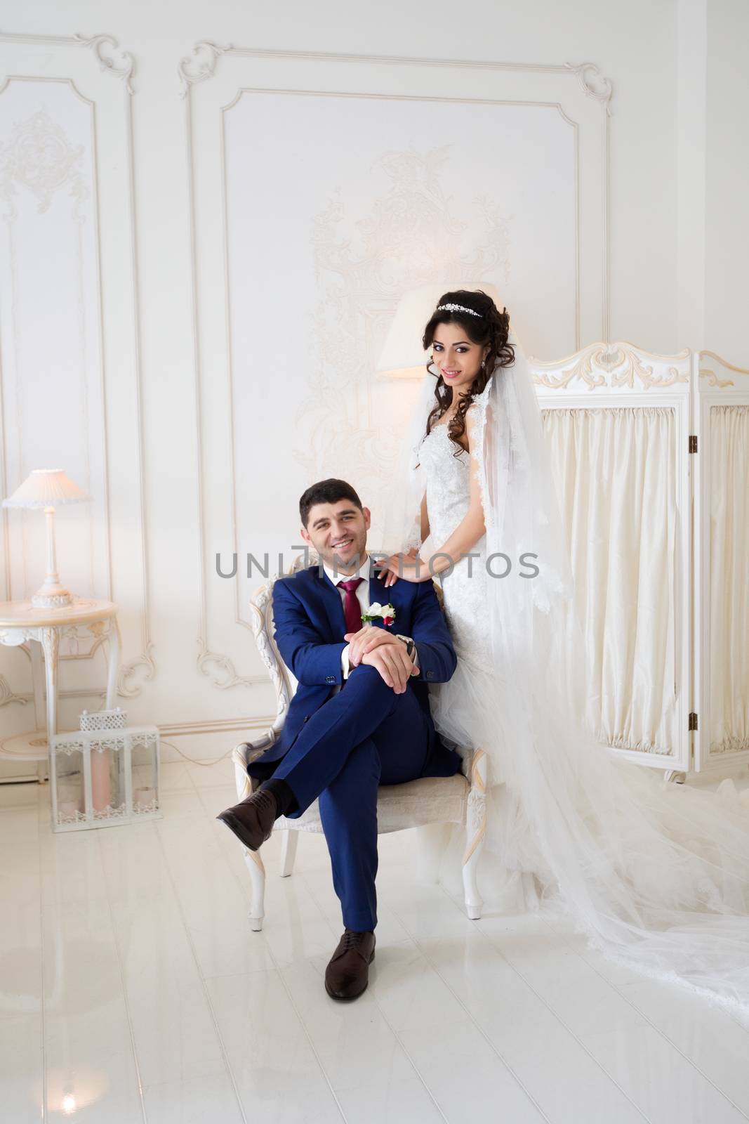 The groom gently hugged the bride on the wedding day