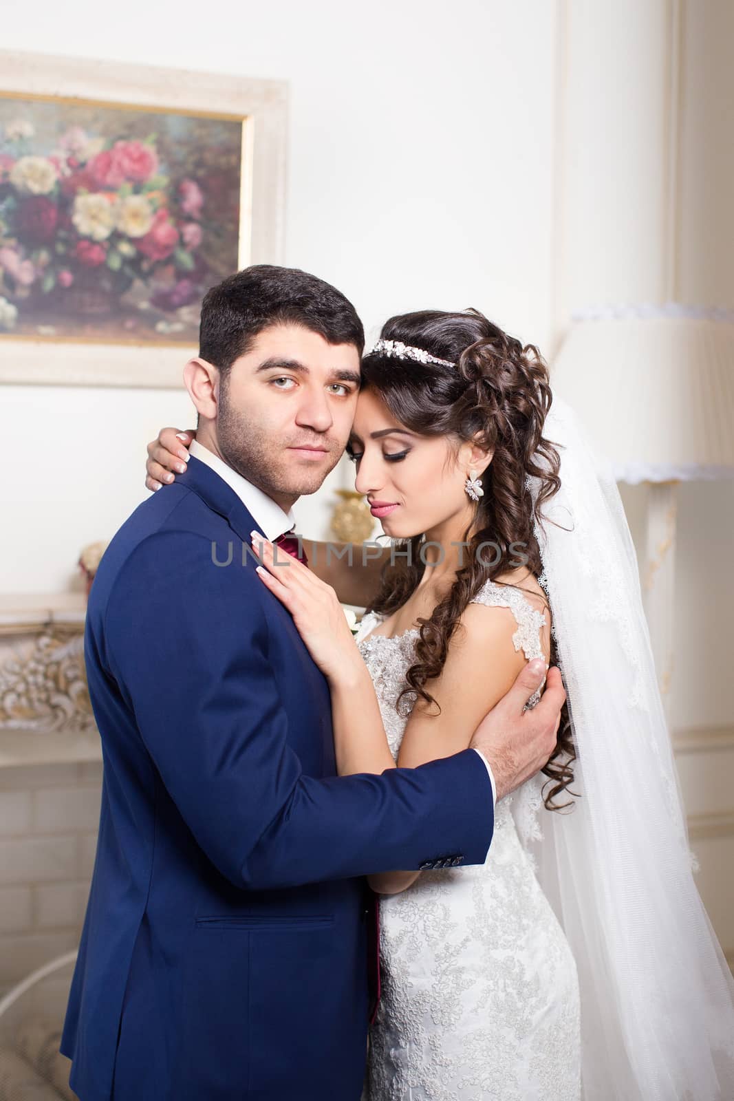 The groom gently hugged the bride on the wedding day