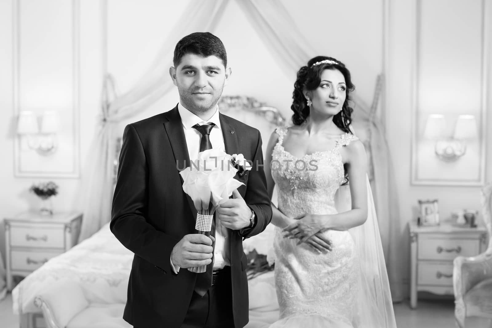 The groom gently hugged the bride on the wedding day