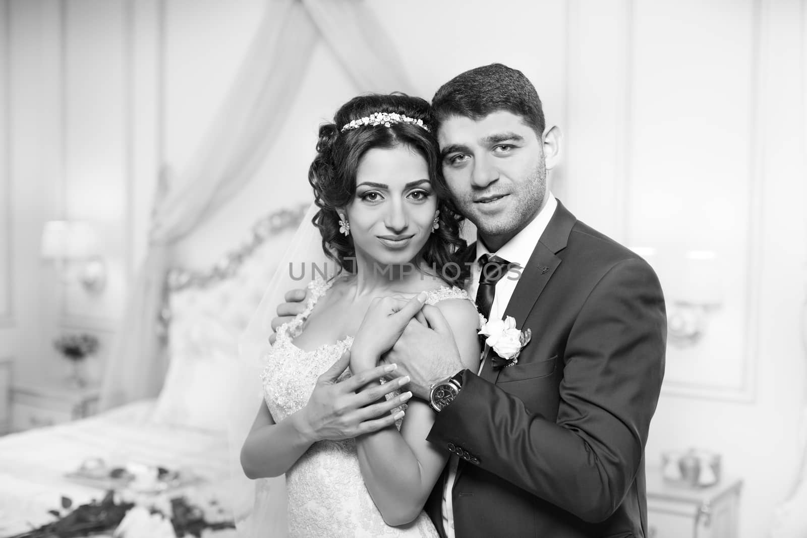 The groom gently hugged the bride on the wedding day