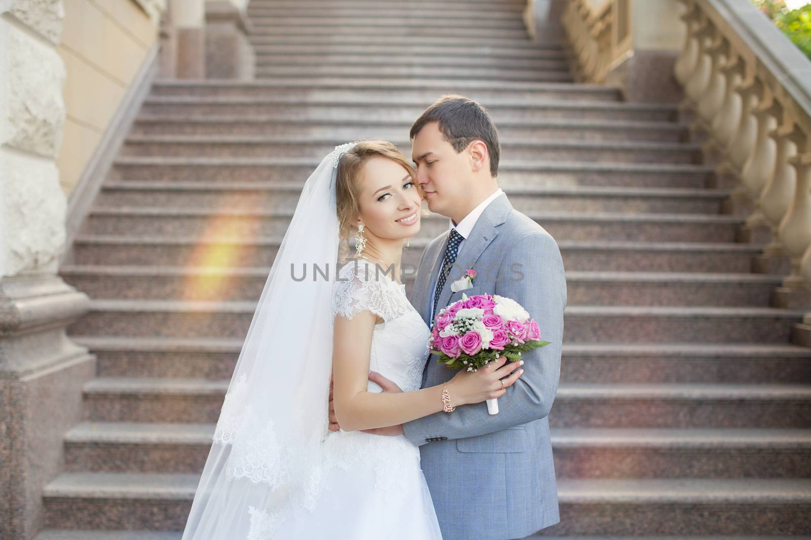 The bride and groom for a walk