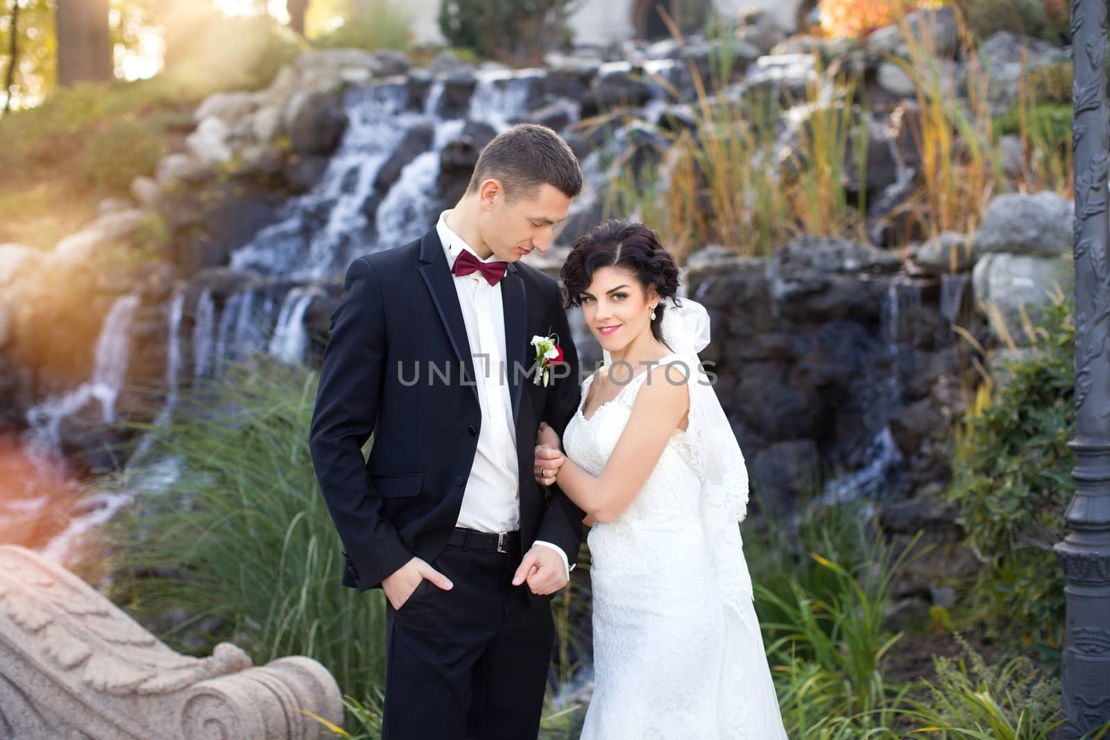 wedding copule. Beautiful bride and groom. Just merried. Close up. Happy bride and groom on their wedding hugging. 