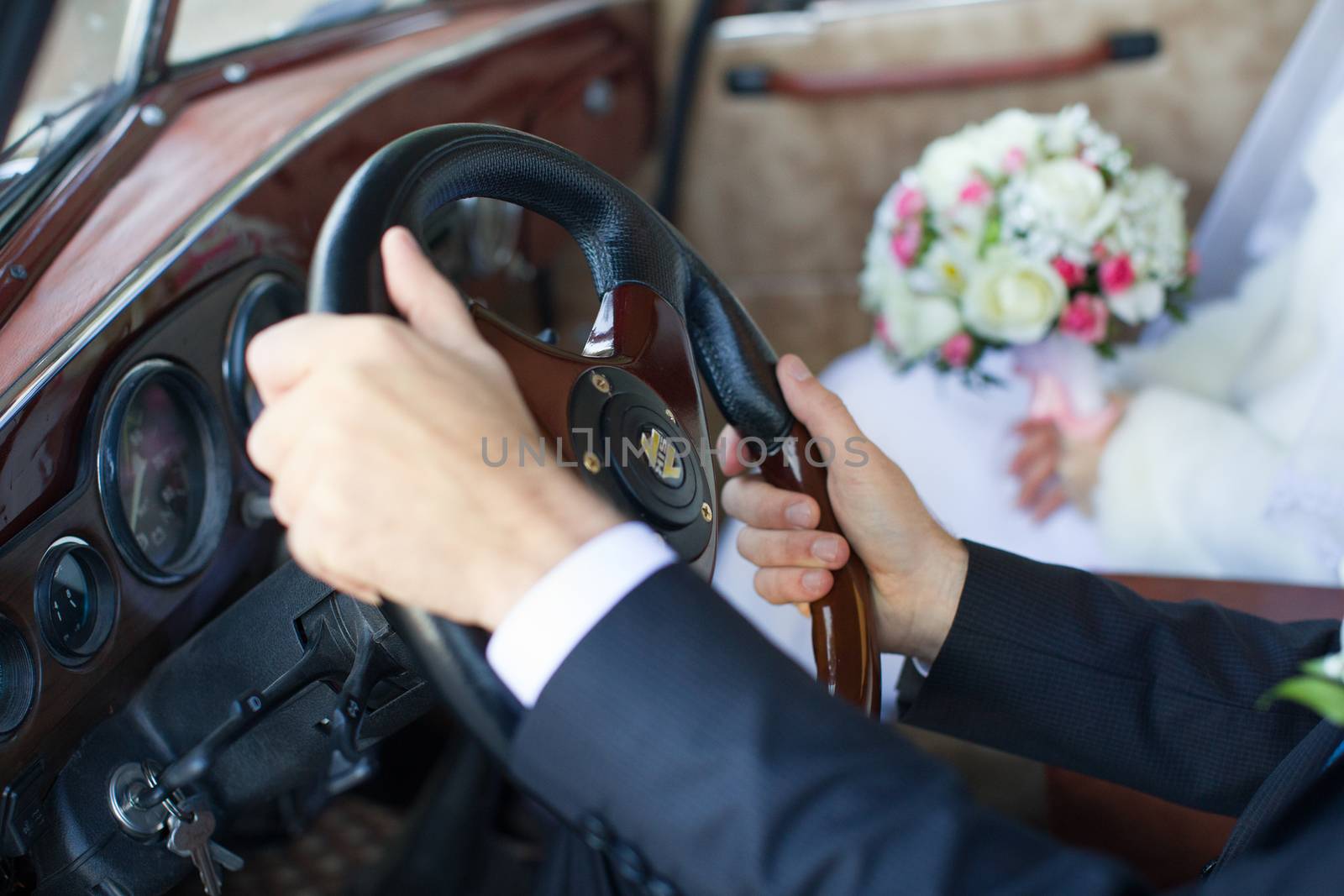 The groom gently hug the bride's hands