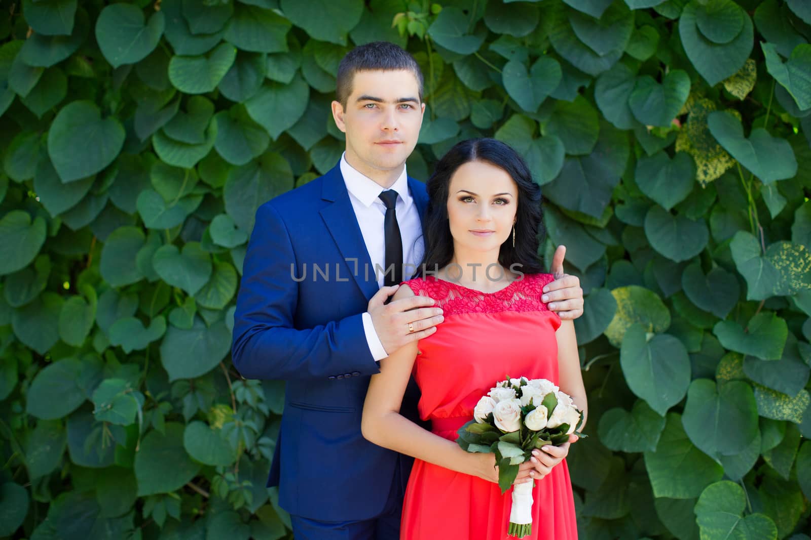 Woman hugging a man she in love with and smile outdoors