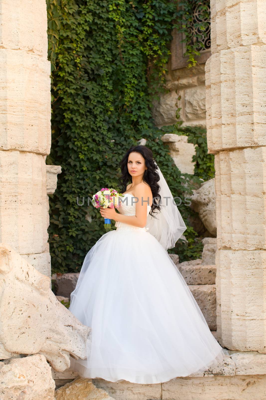 Brunette bride in a white dress by lanser314