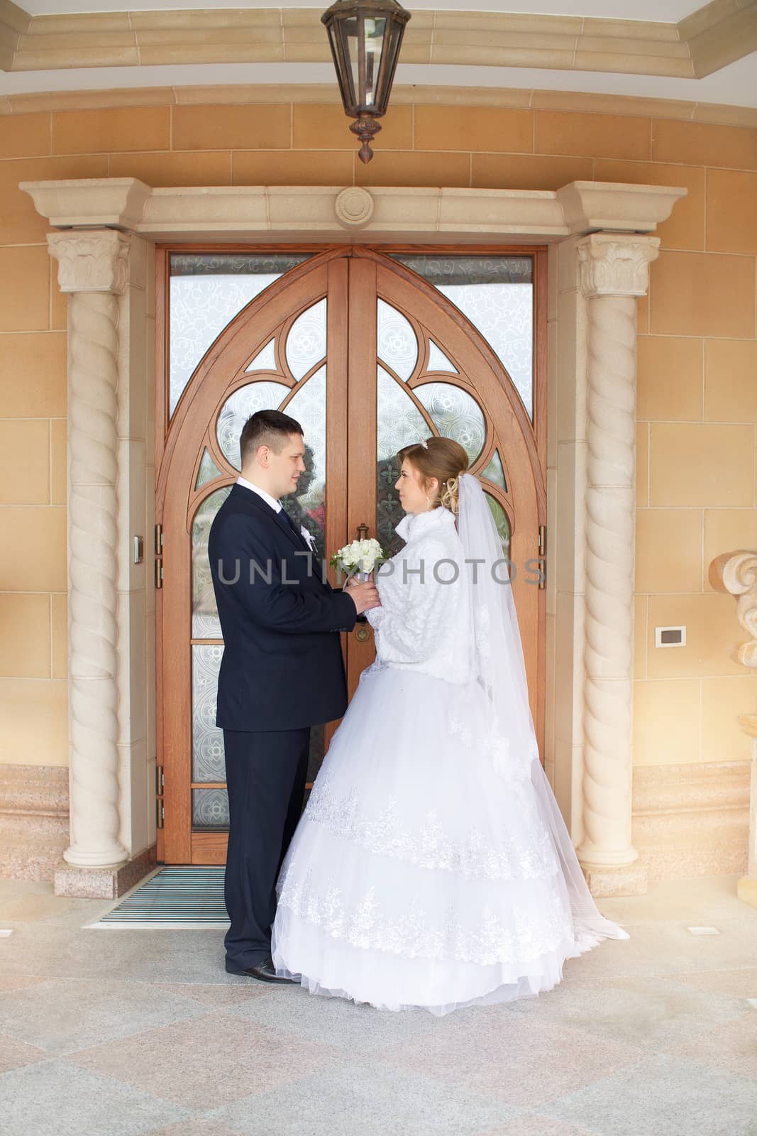 happy beautiful bride and groom walking on field. Loving wedding couple outdoor. Bride and groom.Wedding concept.