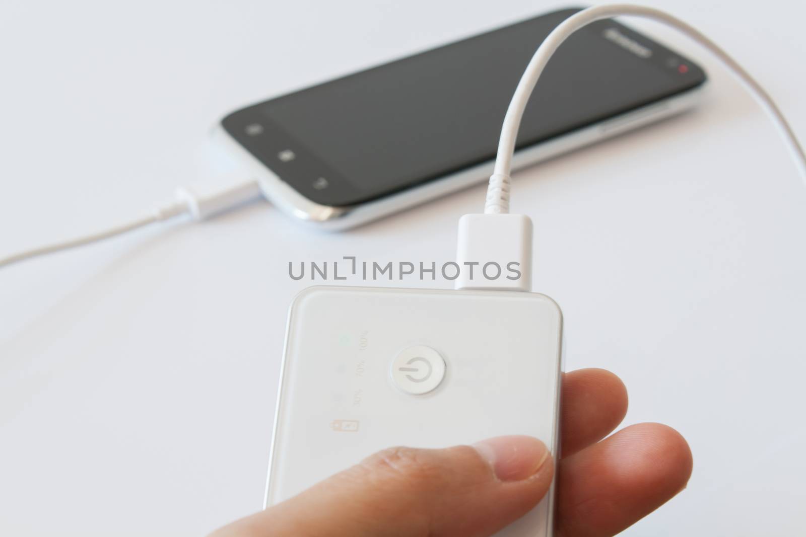 Smartphone is charging with power bank while it standby