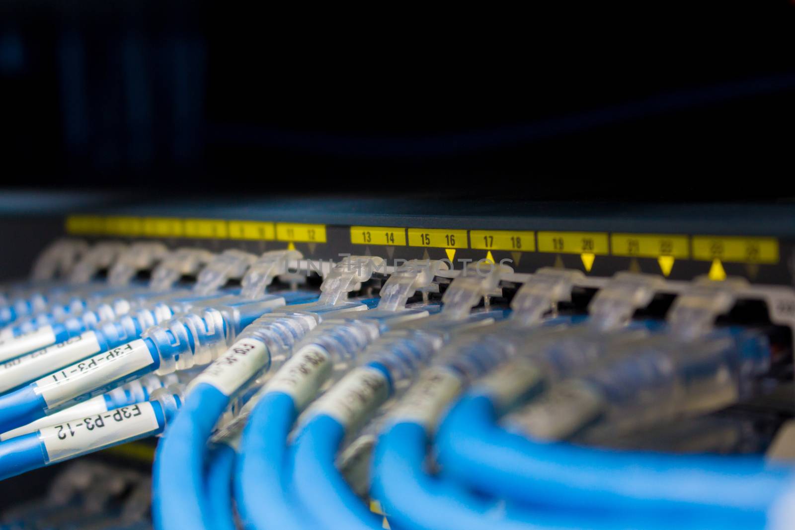 front side of working data servers with flashing LED lights