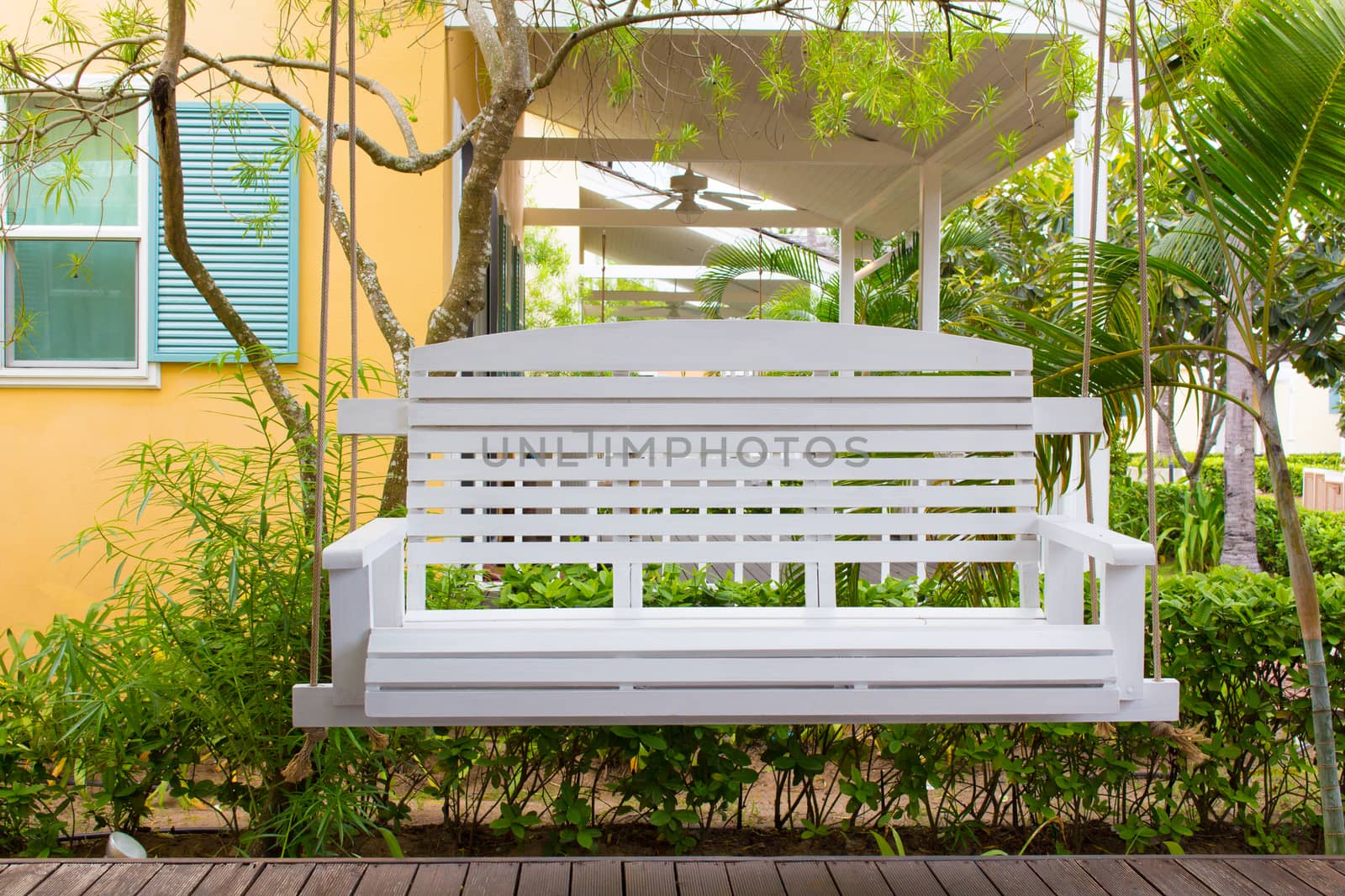 Front porch with a white porch swing