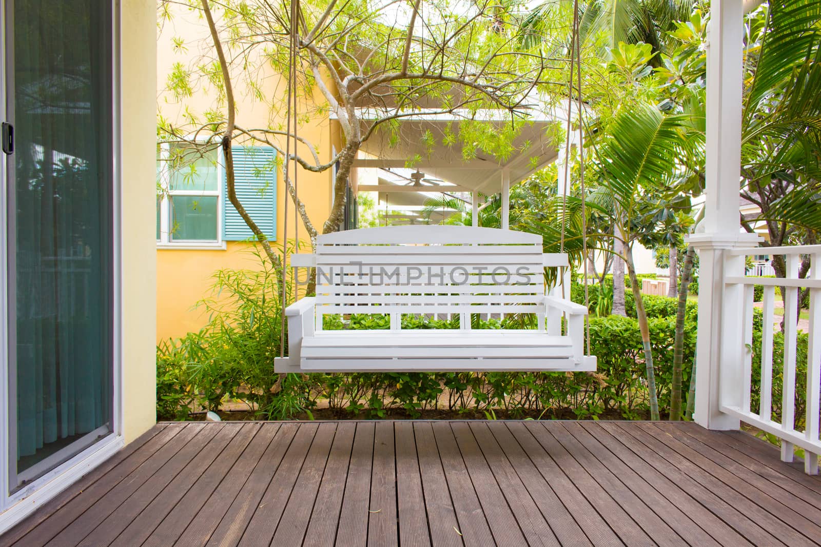Front porch with a white porch swing