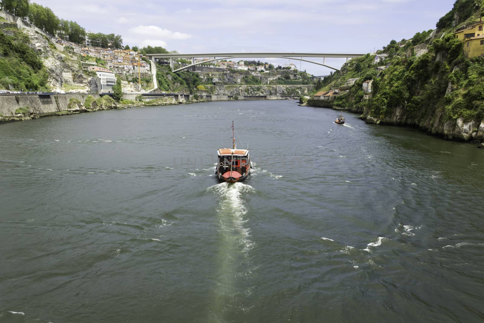 A view of Ancient city Porto, Infante Bridge, Douro River, boat