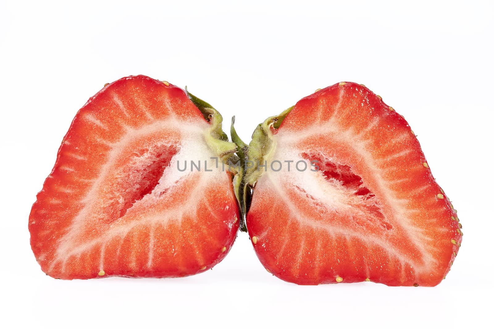 fruits of red cut  strawberries isolated on white background.