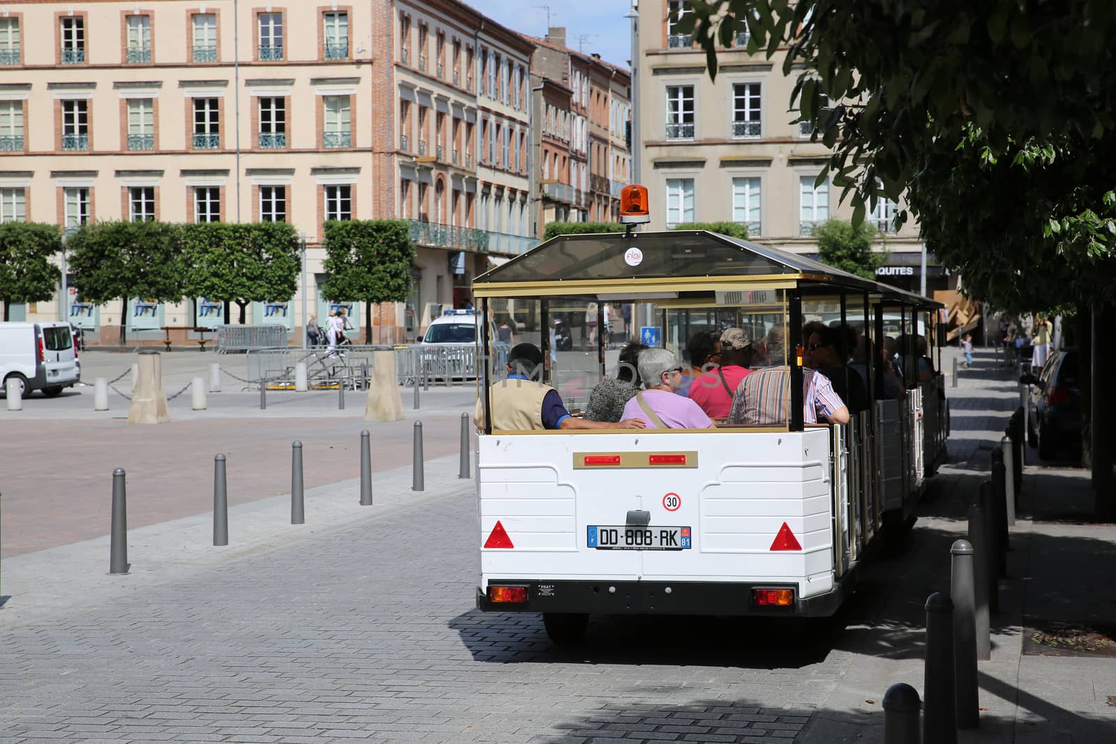 Rear View of a White Trackless Train in France by bensib