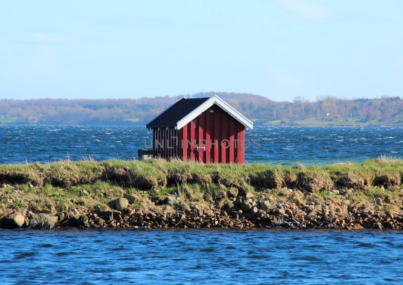 Swimmers dressing house at lake in Denmark