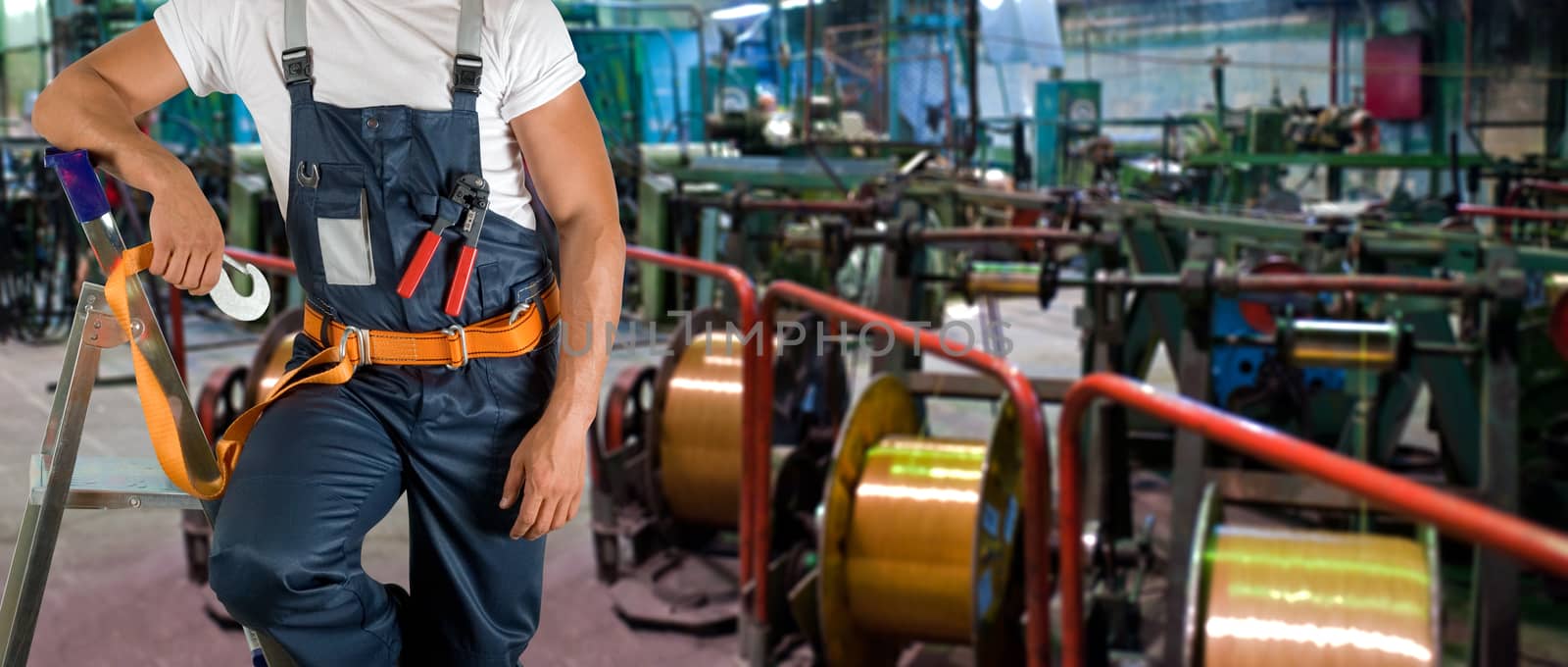 Worker with instruments at industrial factory