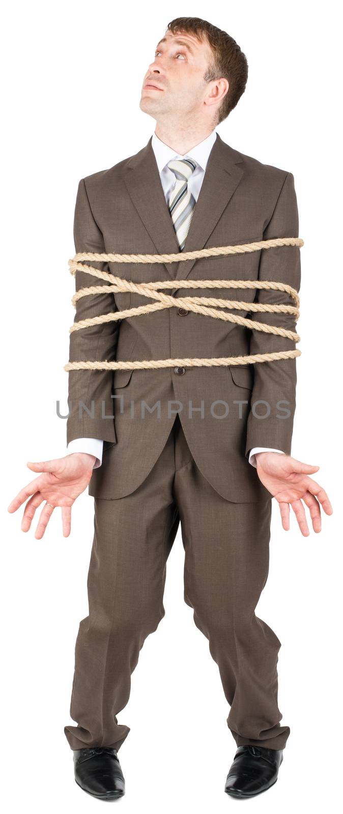 Businessman with briefcase and tied with rope screaming