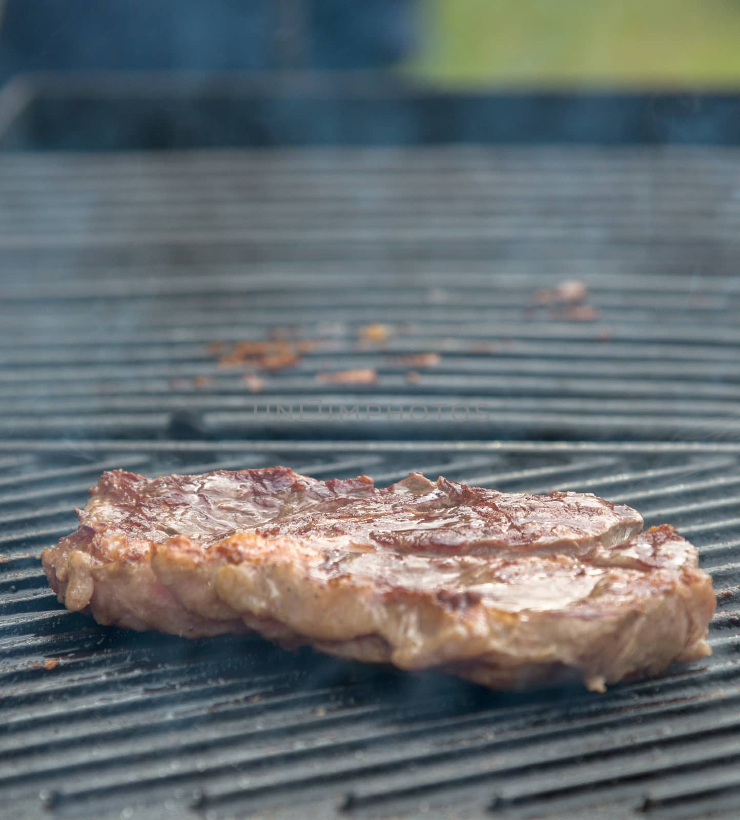 beef steaks on the grill by vlaru