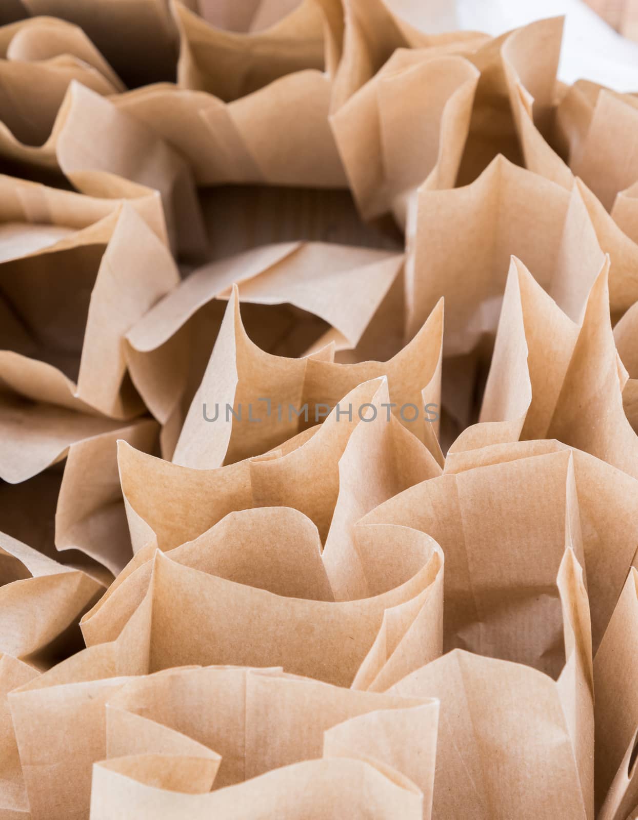 Brown paper disposable bags in the pile by vlaru