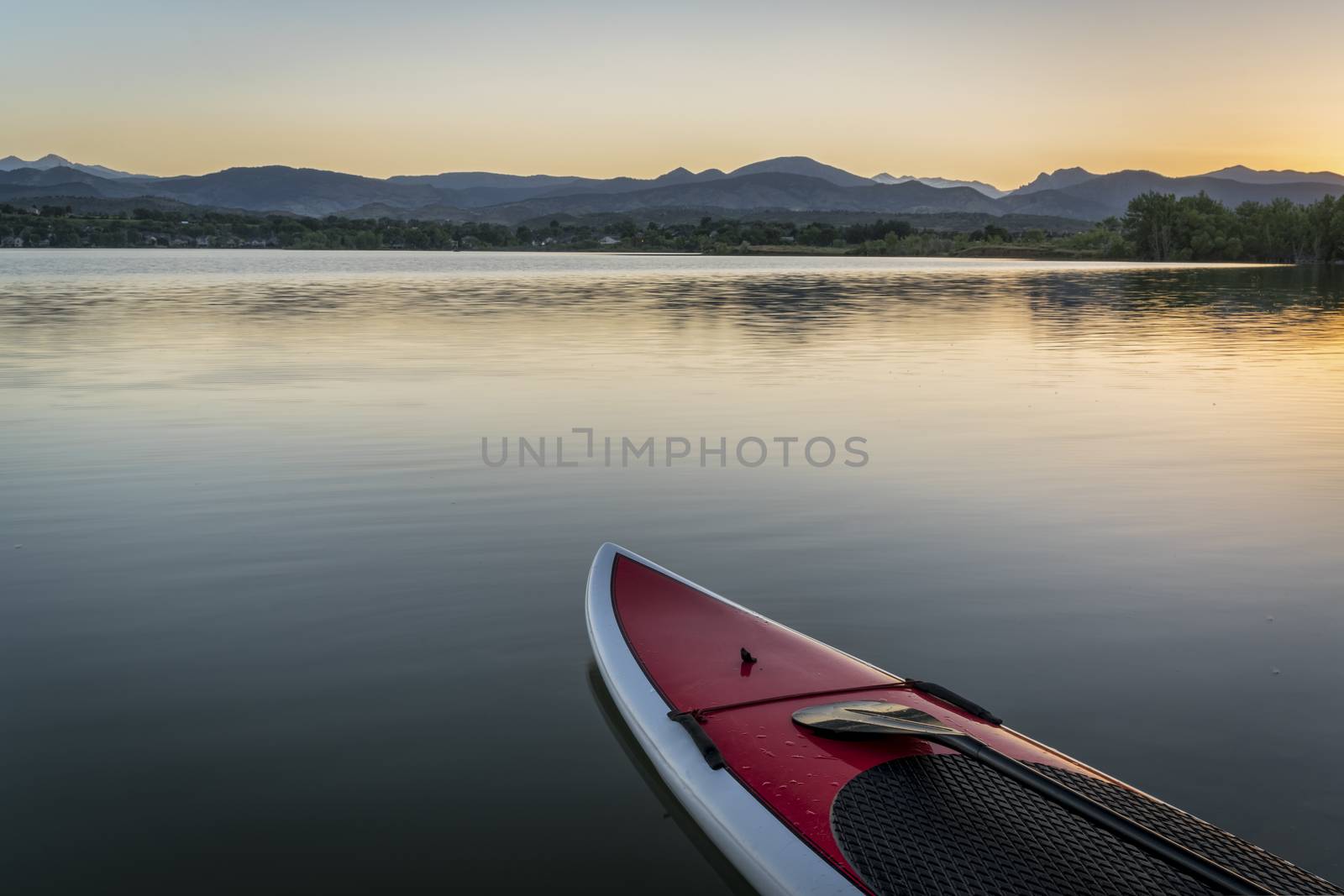 stand up paddleboard on lake by PixelsAway