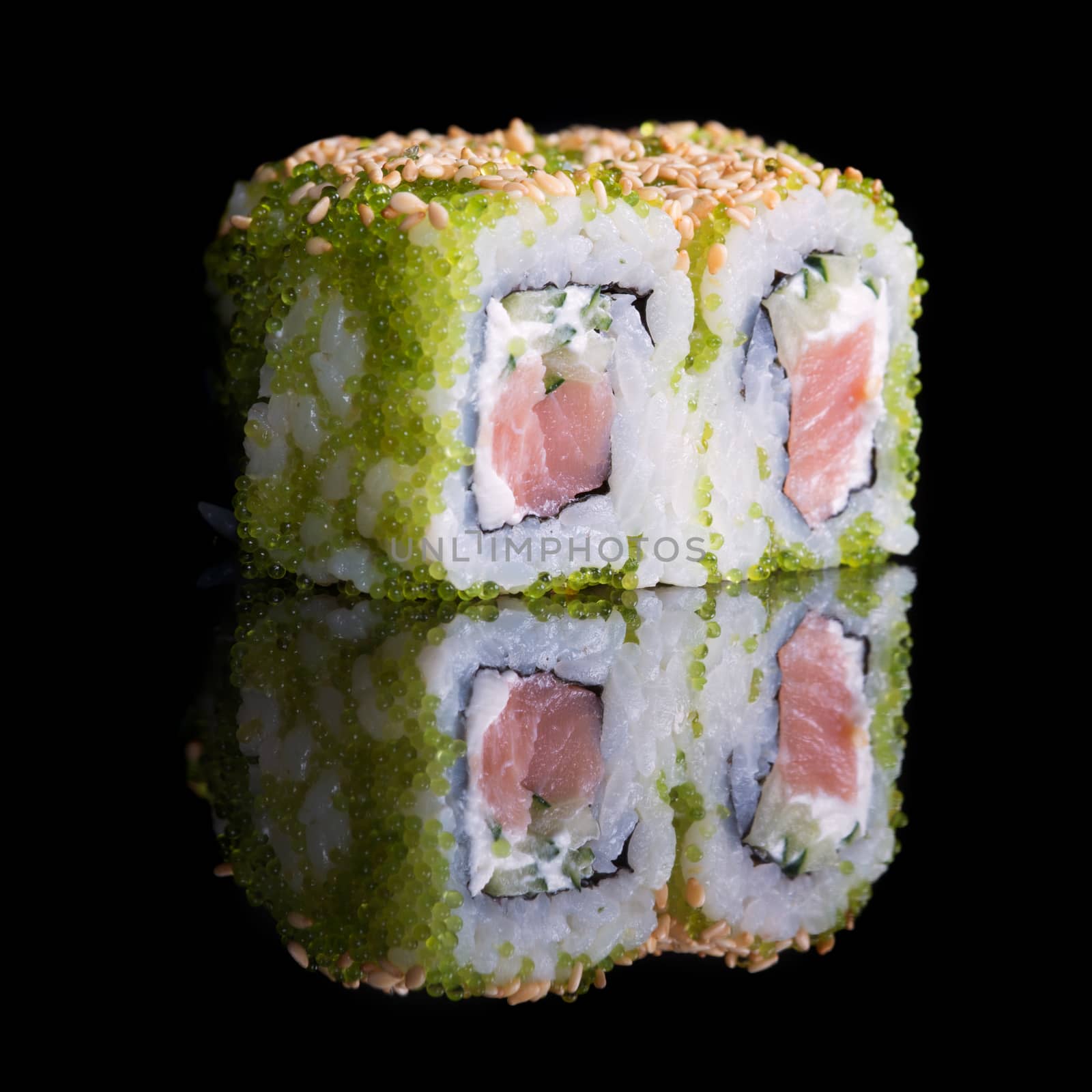 Sushi rolls with salmon, cucumber and flying fish roe by kzen