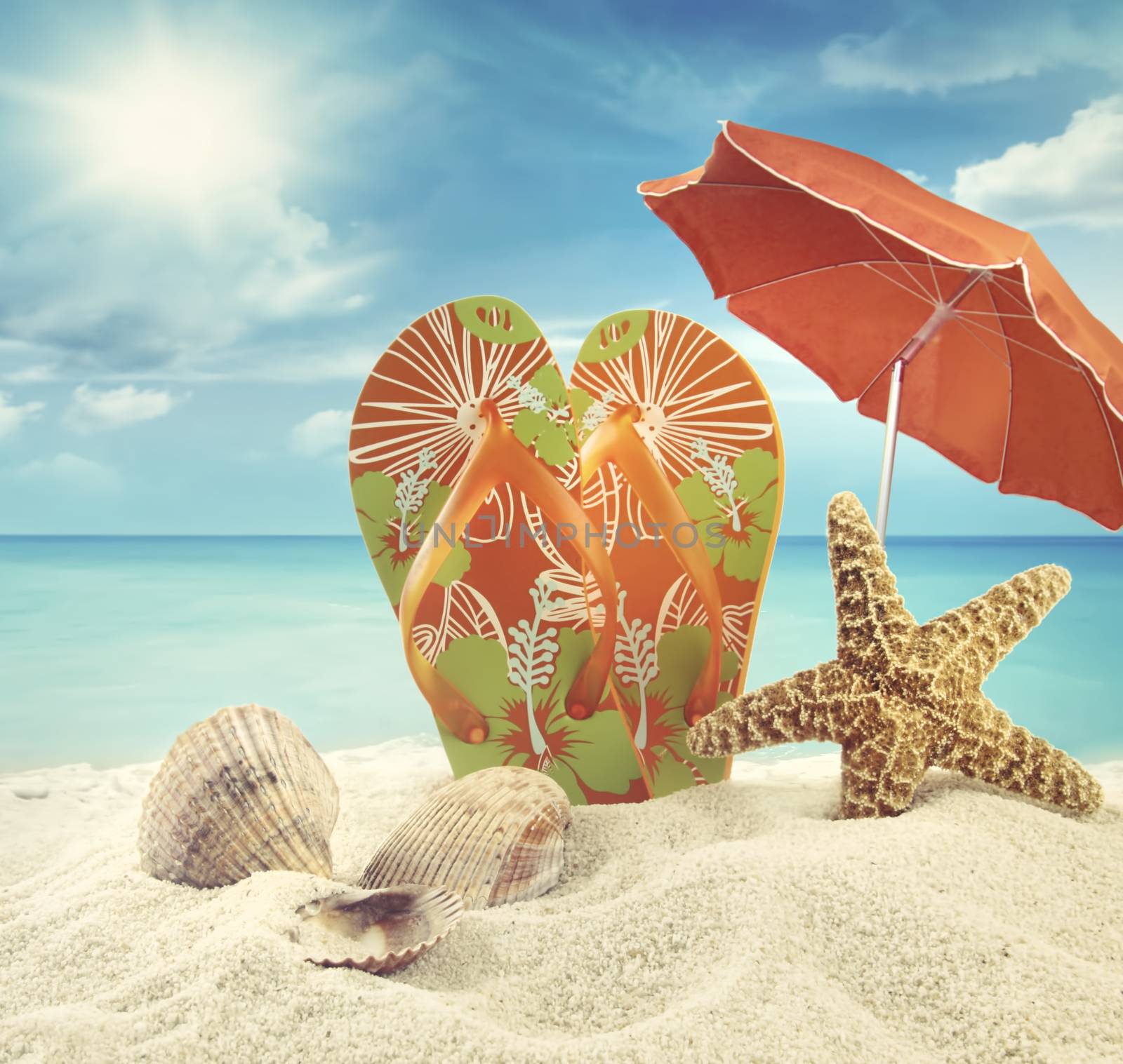 Sandals and starfish with beach umbrella at the ocean by Sandralise