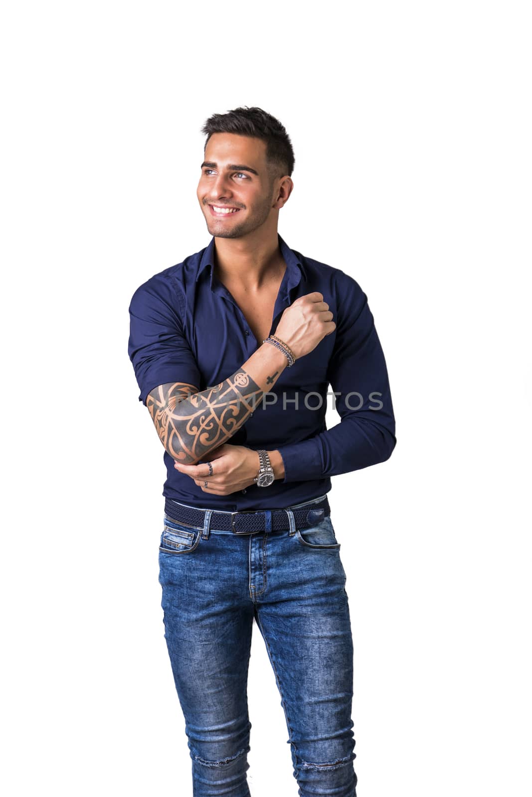 Young smiling man in blue shirt and jeans isolated by artofphoto