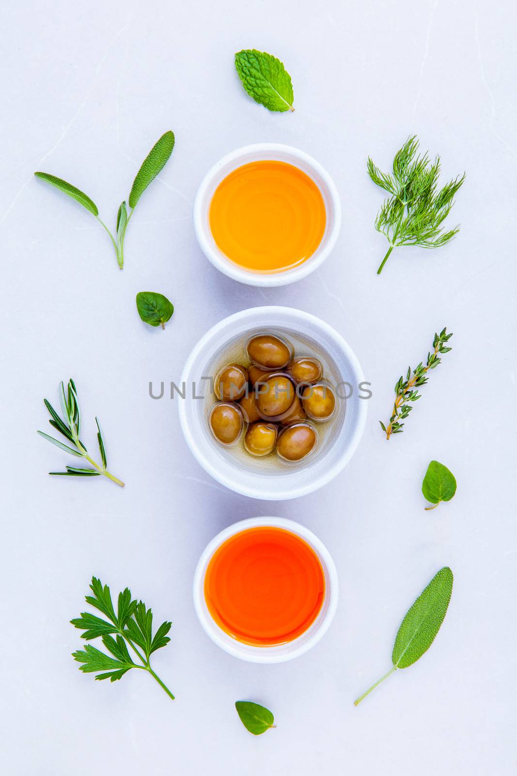 Different sorts of cooking oil,olive oil flavored and Sesame oil with spices  set up with marble background concept for international cuisine.
