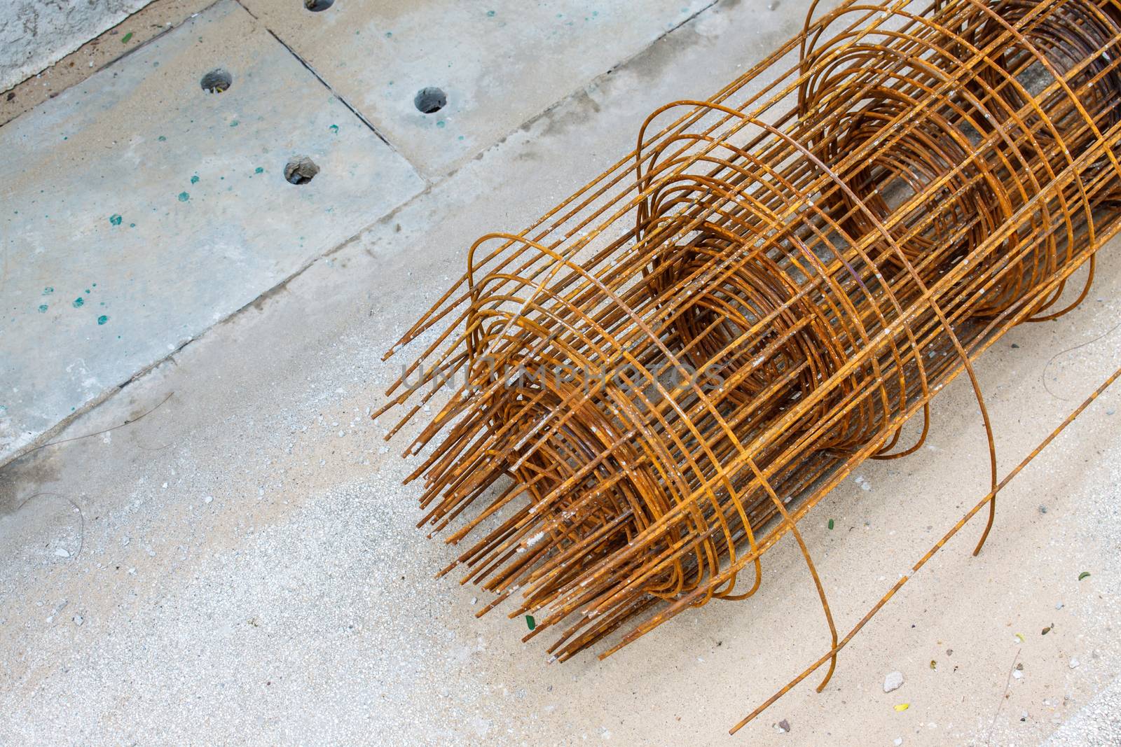 Old steel rebar in a construction site by worrayuth