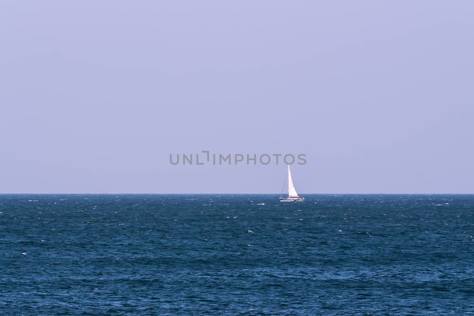 The sail boat on Mediterranean blue sea