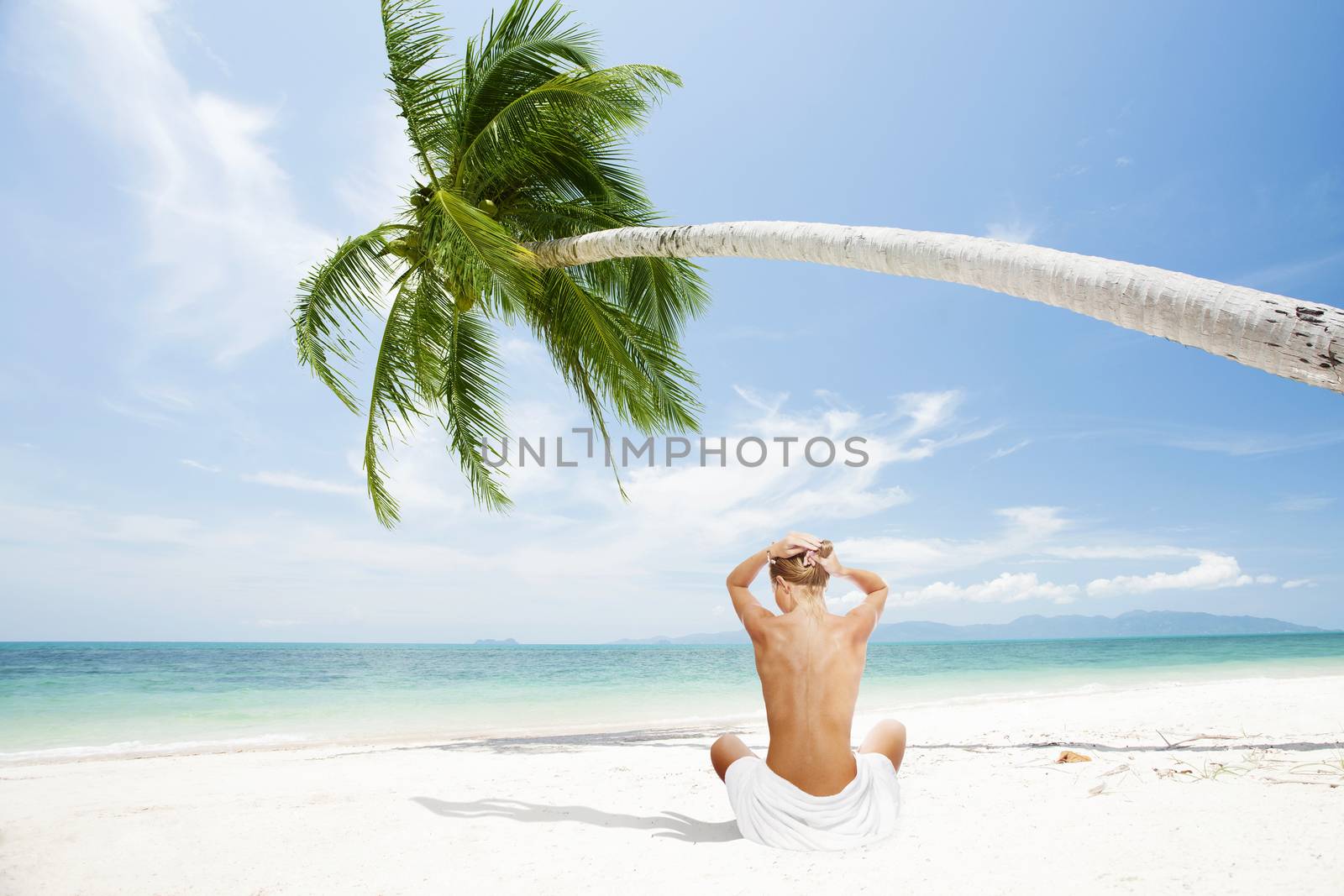 view of young beautiful woman in tropical beach environment