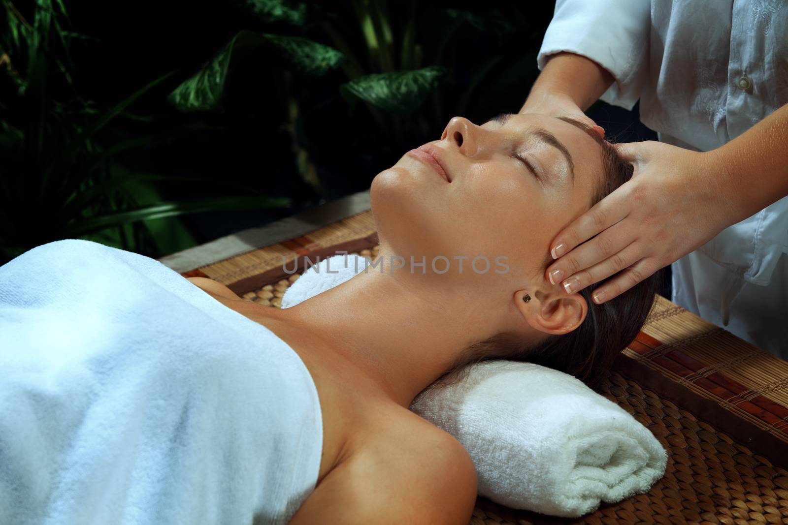 portrait of young beautiful woman in spa environment.