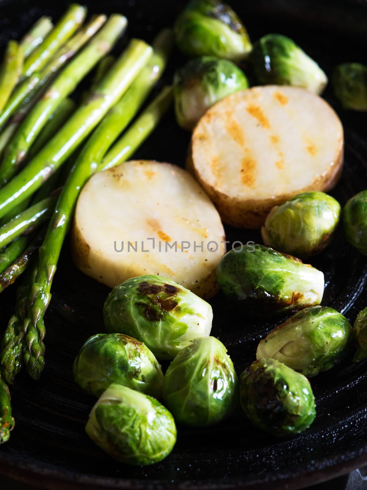 close up view of nice fresh vegetables is being fried