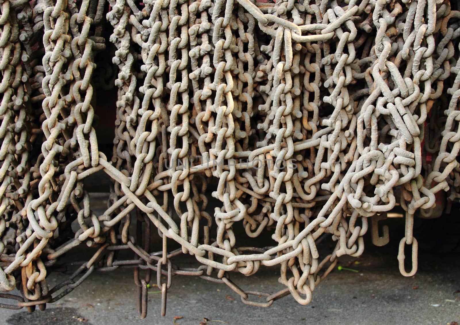 Industrial gray chains hanging on a truck