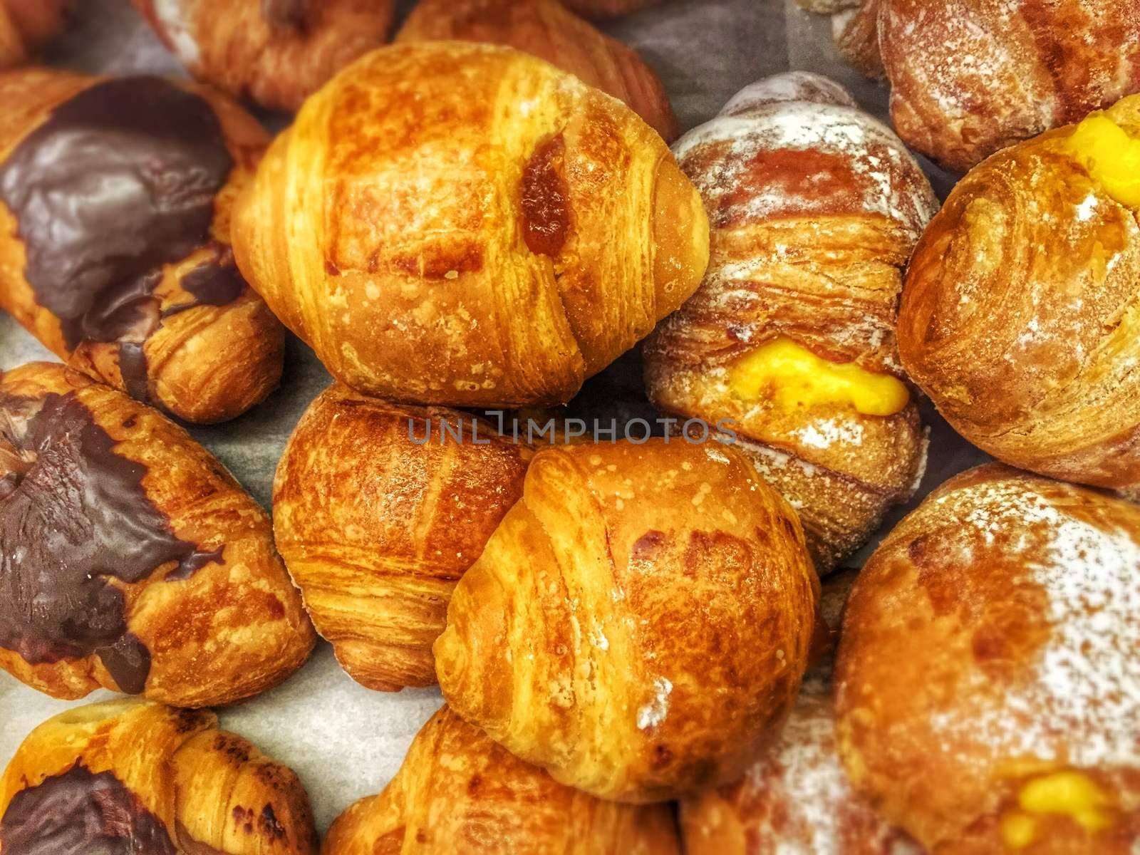 a bunch of sweet croissants ready ofr breakfast