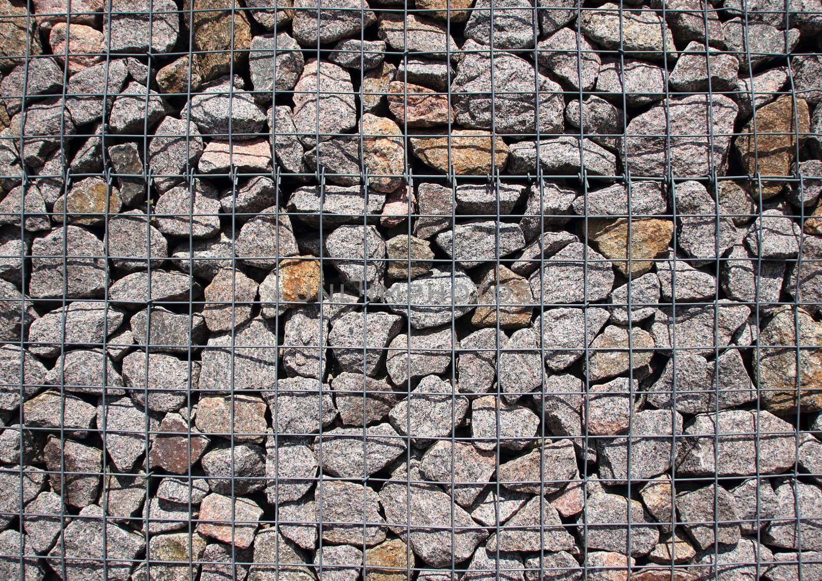 Rocks in solid metal grid construction
