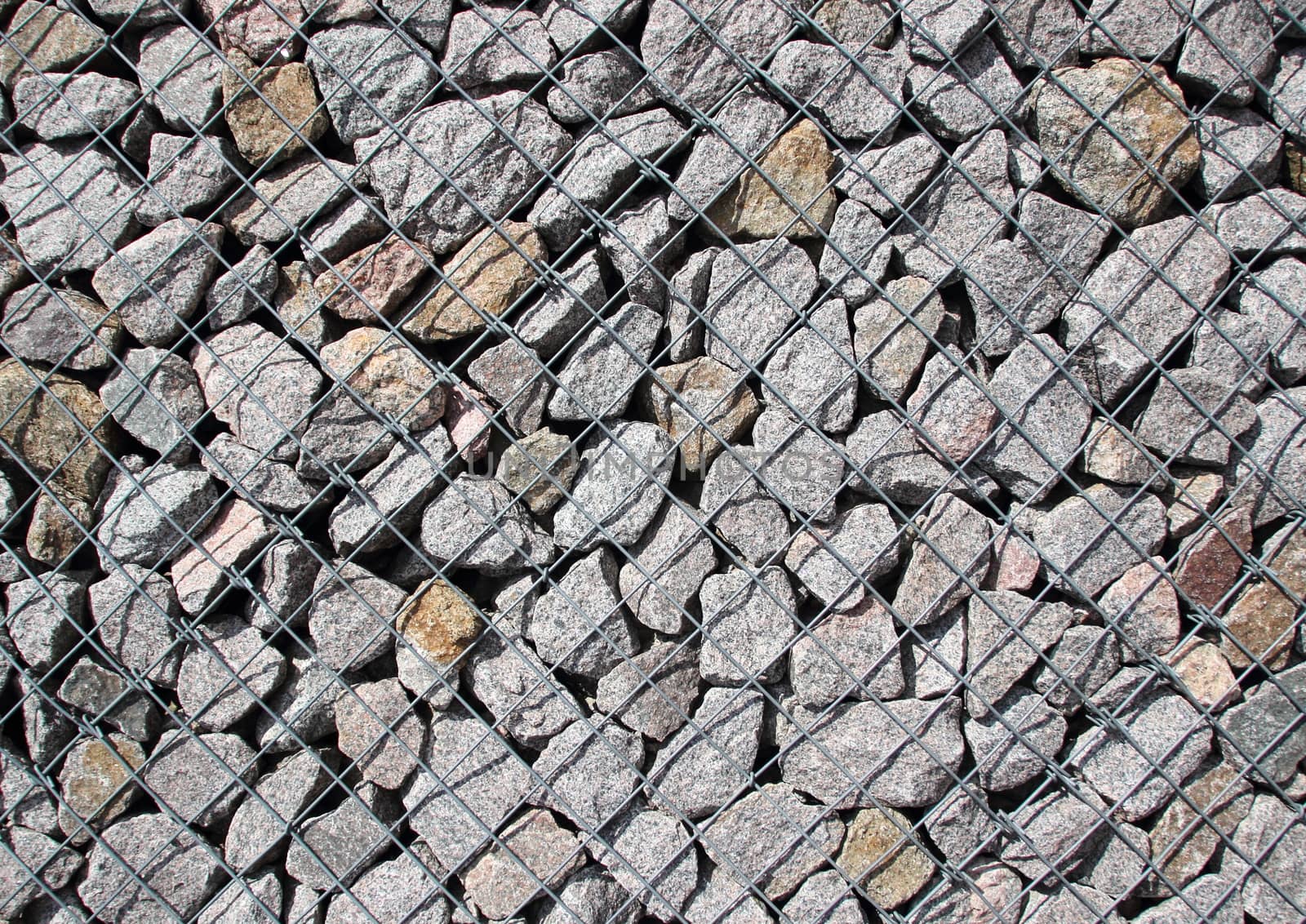 Rocks in  solid metal grid construction diagonal